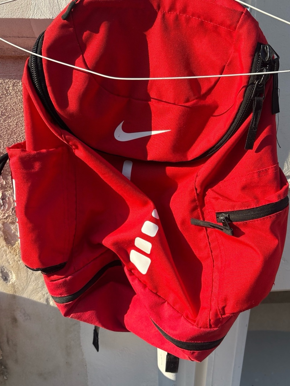 Nike Red Backpack with White Swoosh and Accents